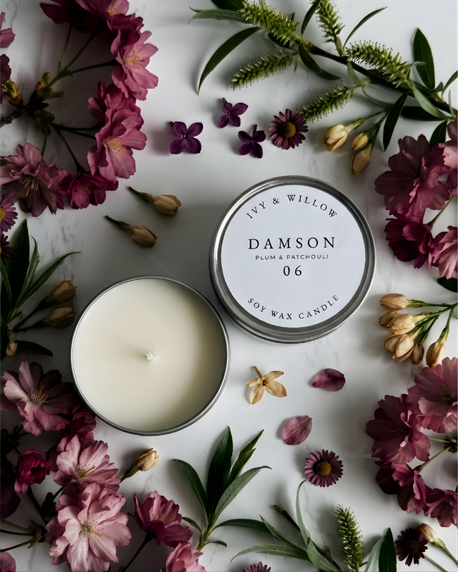 DAMSON mini tin 125g  on a flatlay of RED FLOWERS