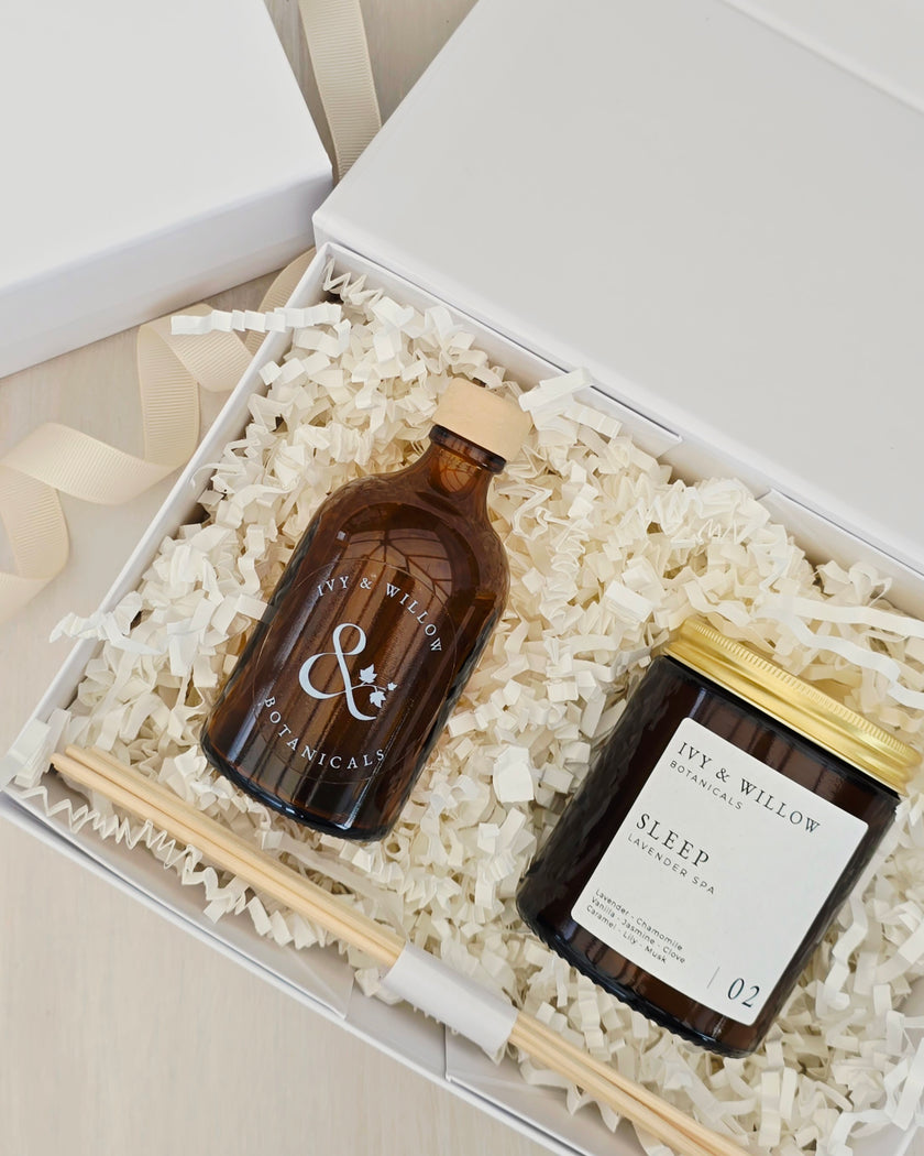 Two bottles and a jar labeled 'Ivy & Willow' in a white box with crinkle paper.