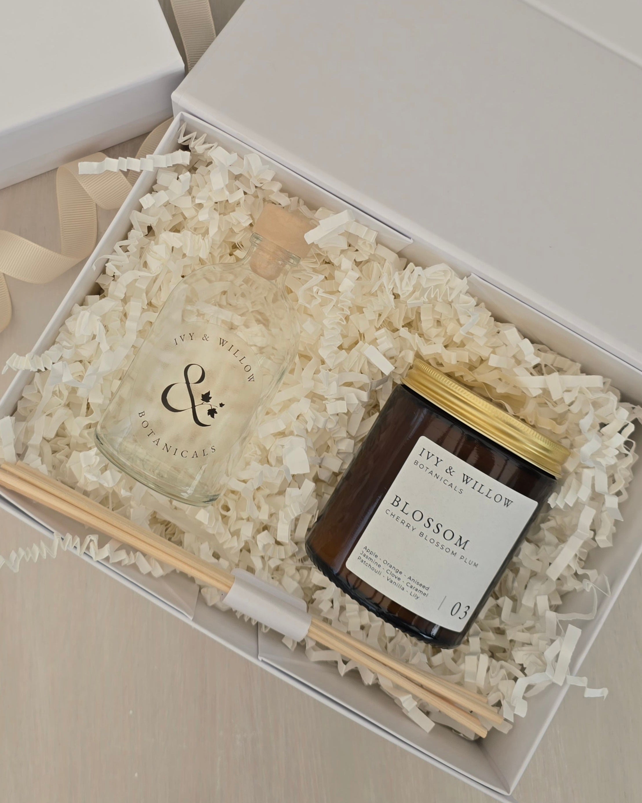 Candle and diffuser set in a gift box with 'Ivy & Willow' branding.