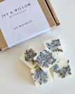 IVY & WILLOW BOTANICALS soy wax melts on a white surface with a branded box.