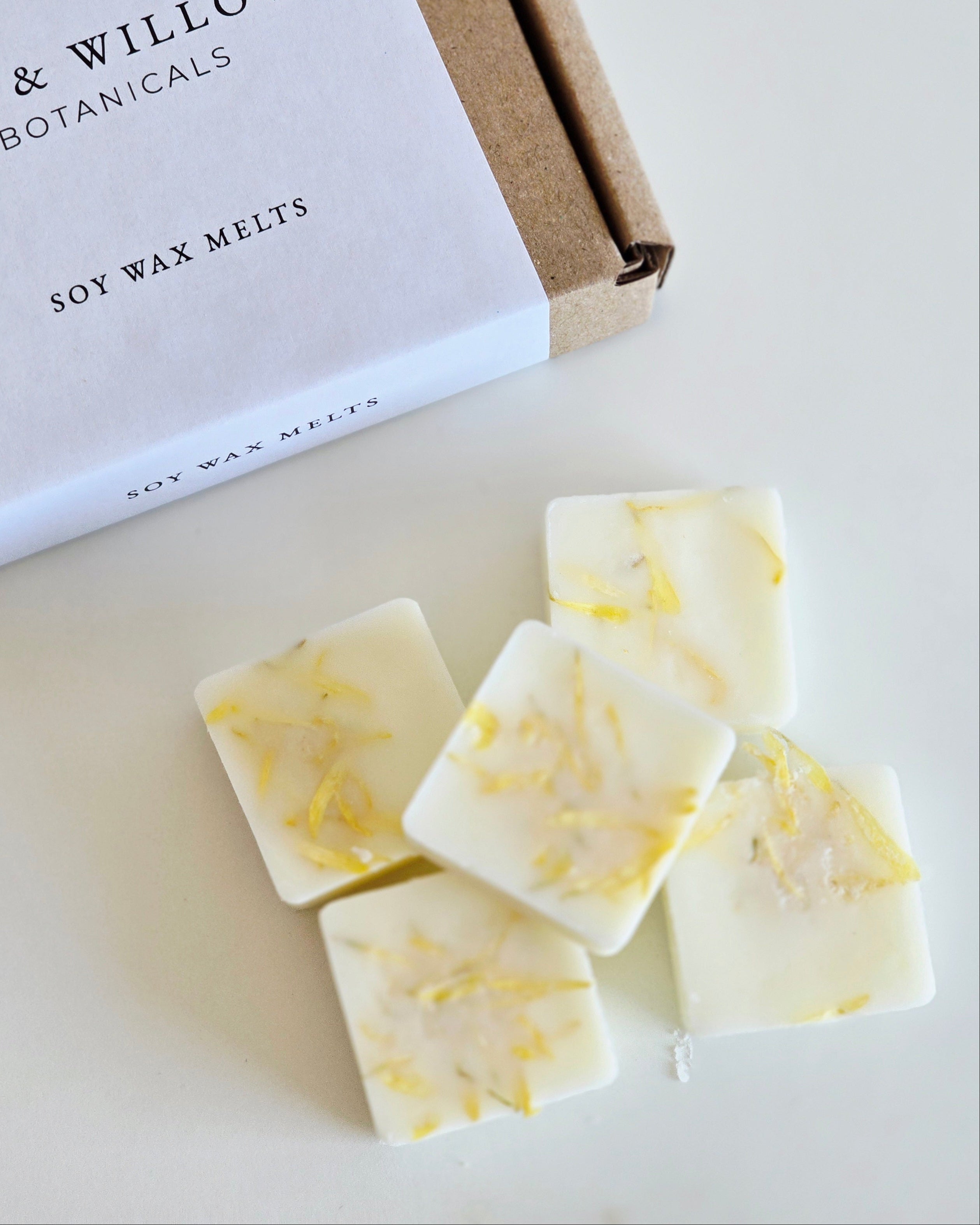 IVY & WILLOW Botanicals soy wax melts on a white surface with a branded box.