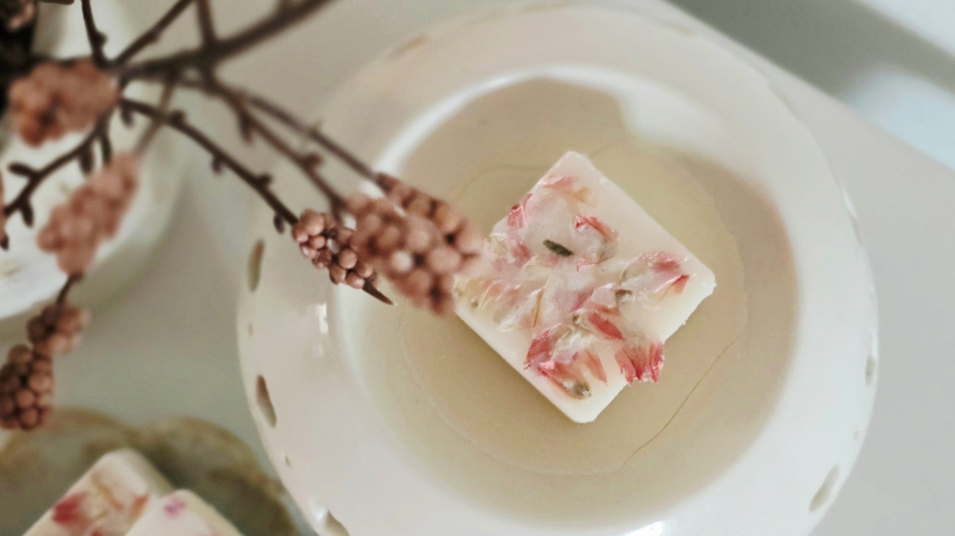Decorative waxmelts with floral design on a white plate