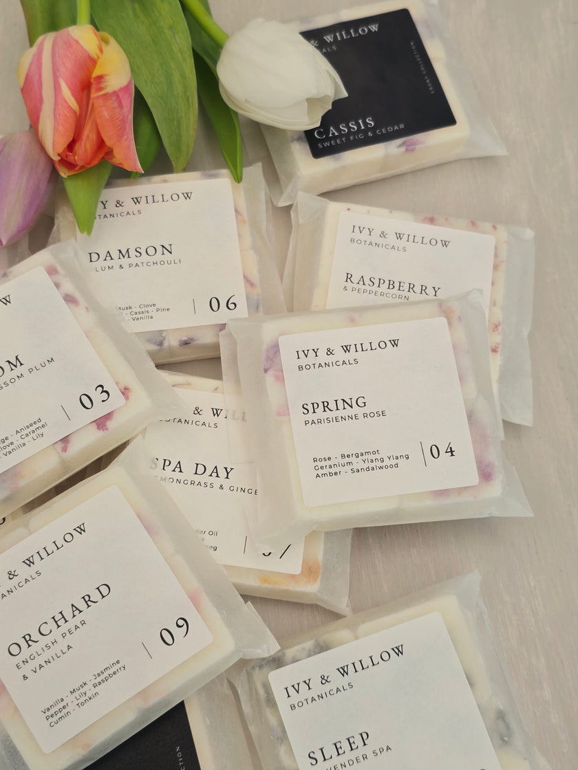 Collection of IVY & WILLOW product packaging with tulips on a light background