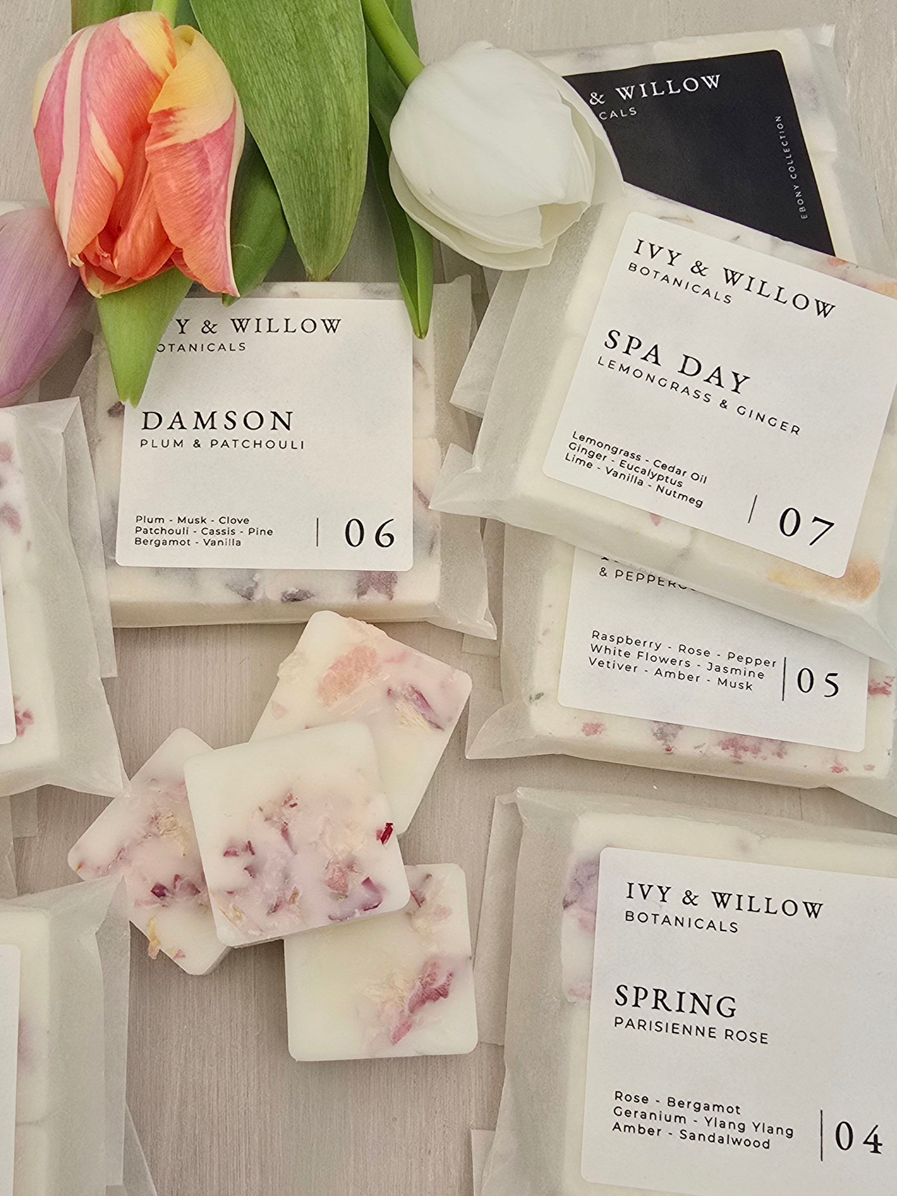 Ivy & Willow botanical waxmelt bars with labels on a wooden surface