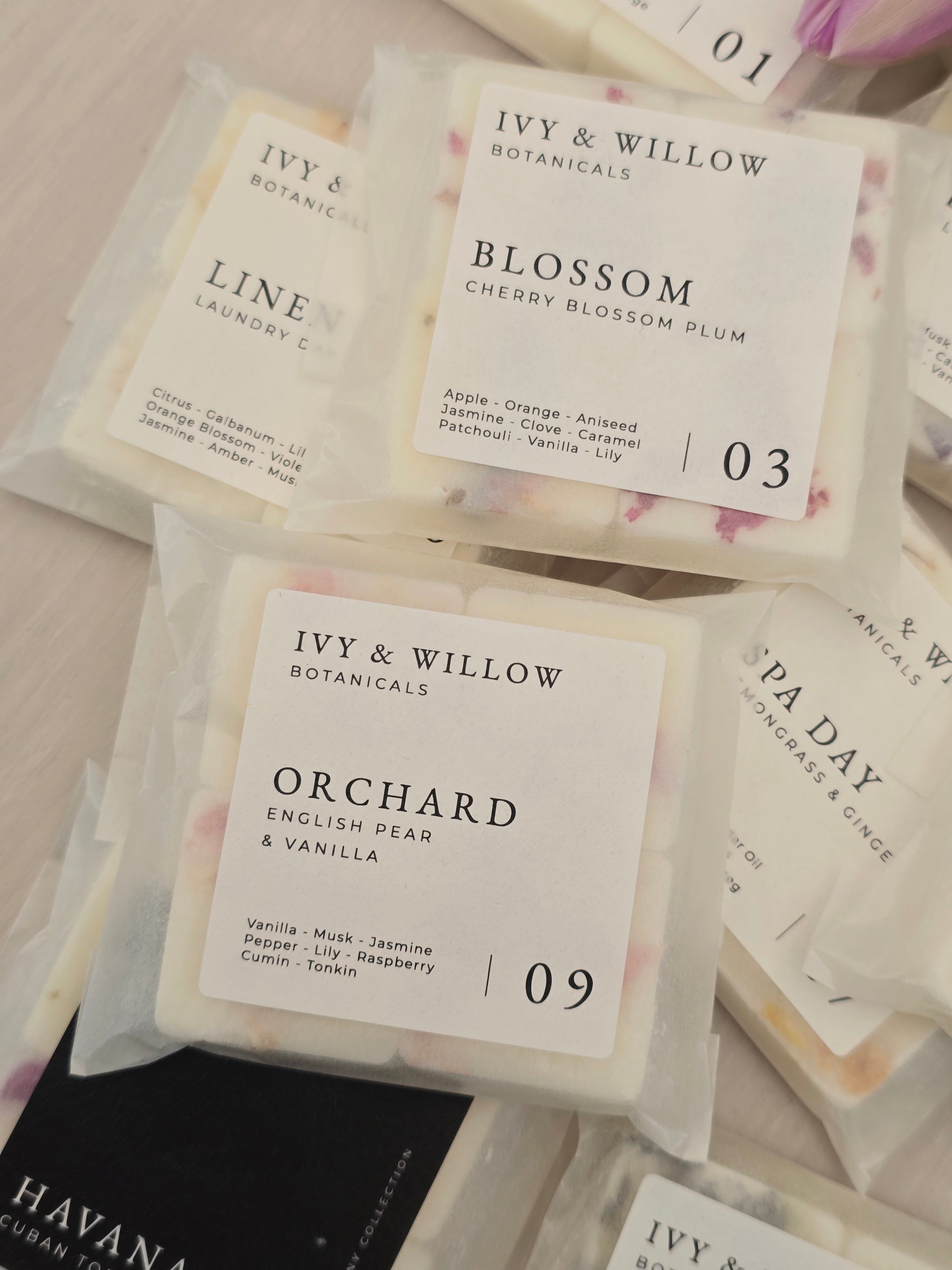 Collection of Ivy & Willow Botanicals soap bars with labels on a light background